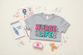 Scrub Squad Plus nurse bundle flat lay with tee and nurse accessories